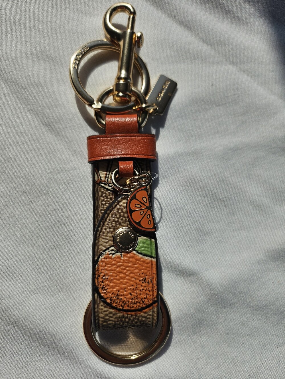 Coach Trigger Snap Bag Charm in Signature Canvas With Orange Print